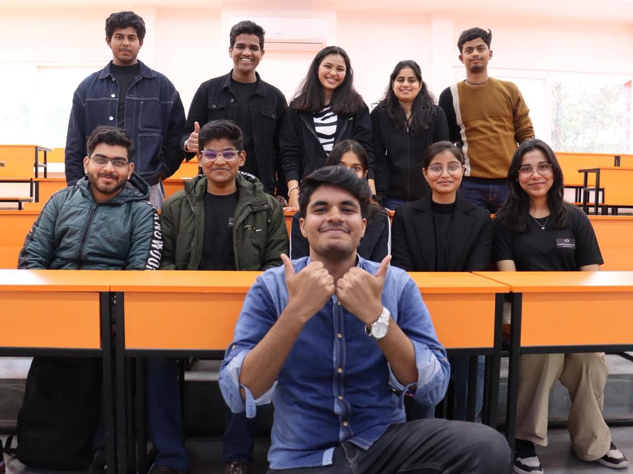 Students seated at a Google Developer Groups Cloud and Gen AI session on campus.